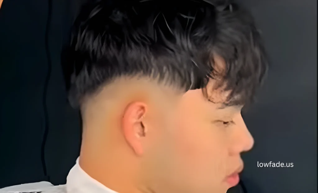 low taper fade with fluffy hair