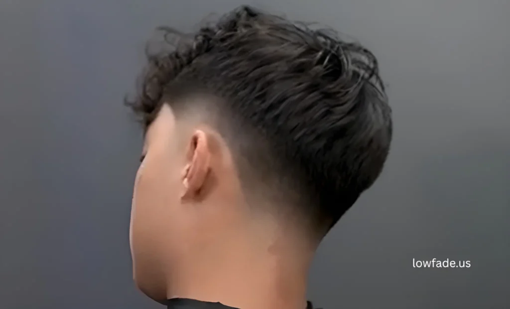 low taper fade with fluffy hair on top